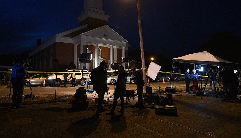National and local media outlets line the street Tuesday, Nov. 22, 2016, at New Monumental Baptist Church for a memorial service to honor six children who were killed Monday, Nov. 21, 2016, when their school bus crashed.