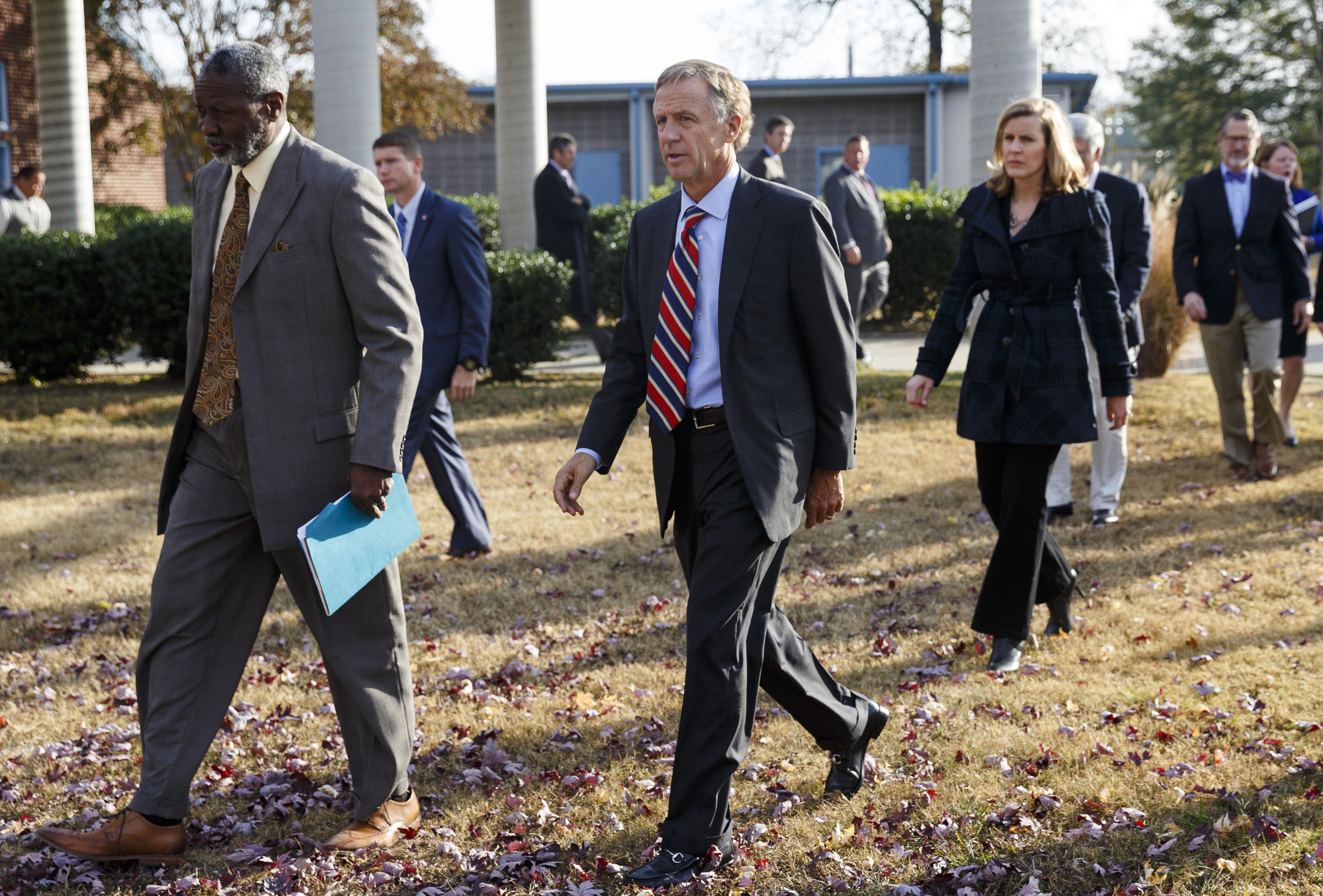 Tennessee Gov. Bill Haslam, center, and Hamilton County Interim School Superintendent Dr. Kirk Kelly, left, walk to a news conference at Woodmore Elementary School on Wednesday, Nov. 23, 2016, in Chattanooga, Tenn. Gov. Haslam visited the school following Monday's school bus crash that killed 6 children and injured dozens more.