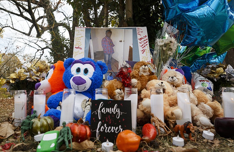 Teddy bears, mementos, and balloons have been placed at the site of a fatal school bus crash on Talley Road on Wednesday, Nov. 23, 2016, in Chattanooga, Tenn. The makeshift memorial to victims of the Monday crash, which killed 6 Woodmore Elementary students and injured dozens more, has grown since the road was reopened Tuesday.