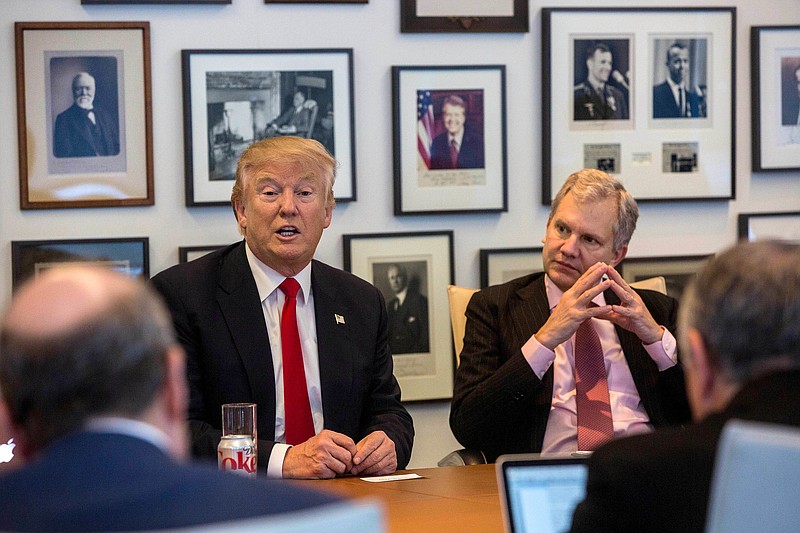 President-elect Donald Trump, left, and New York Times Publisher Arthur Sulzberger Jr., right, appear during a meeting with editors and reporters at The New York Times building, Tuesday, Nov. 22, 2016 in New York. (Hiroko Masuike/The New York Times via AP)
