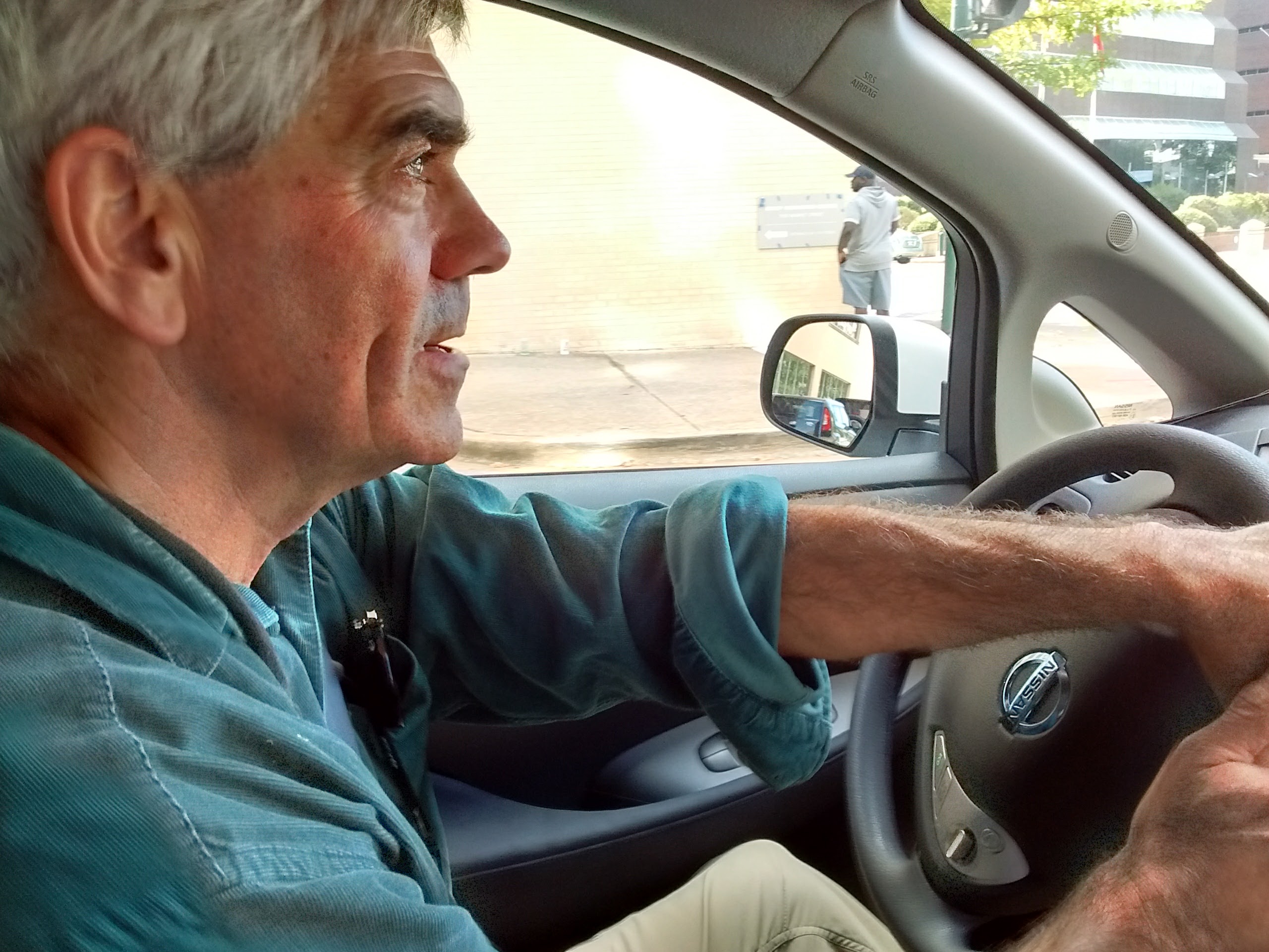 Longtime Chattanooga electric car advocate Jim Frierson drives one of Green Commuter Chattanooga's Nissan Leafs on Oct. 13, the day the program went live.