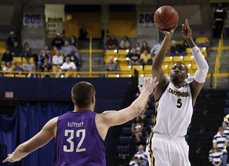 UTC senior Justin Tuoyo, right, is pacing the team this season by averaging 17 points, eight rebounds and 3.8 blocks through five games. The Mocs play today at Kennesaw State.