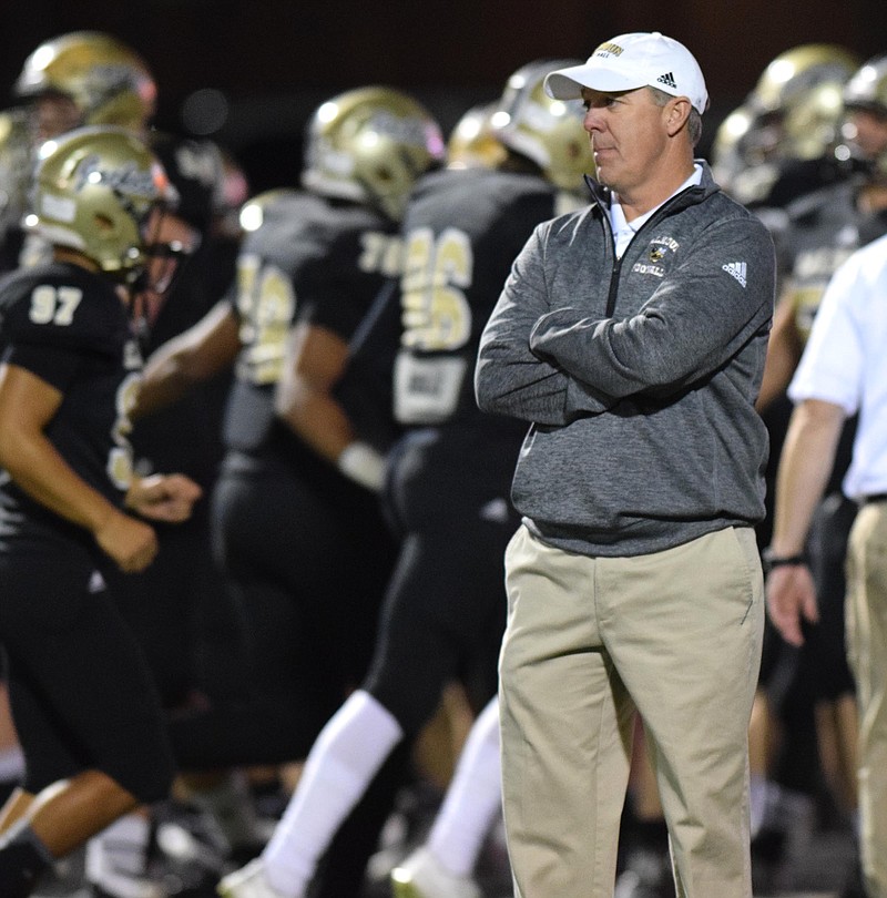 Calhoun head coach Hal Lamb watches his Yellow Jackets warm up.  The Elbert County Blue Devils visited the Calhoun Yellow Jackets in a GHSA Football Playoff game on Friday November 27, 2015.