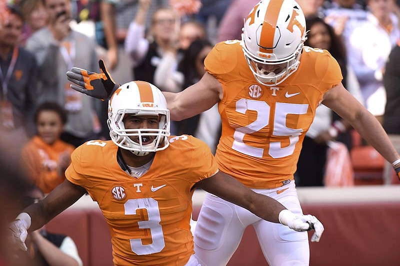 Tennessee's Josh Smith (25) congratulates fellow junior wide receiver Josh Malone on a touchdown catch during the Vols' 55-0 win against Tennessee Tech on Nov. 5 in Knoxville. Malone has 731 yards on 38 catches.