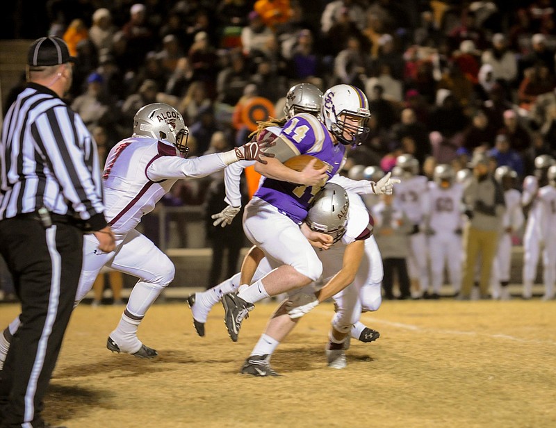 (Photo by Mark Gilliland) Sequatchie County's Ethan Baker tries to get by Alcoa's defense during the game on November 25, 2016.