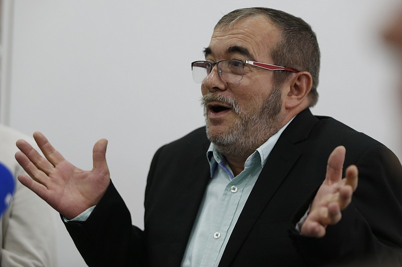 
              Rodrigo Londono, top leader of the Revolutionary Armed Forces of Colombia, FARC, speaks during a roundtable with foreign journalists in Bogota, Colombia, Friday, Nov. 25, 2016, a day after he signed a second, modified peace accord with Colombia's President Juan Manuel Santos to end the country's half-century conflict. (AP Photo/Fernando Vergara)
            