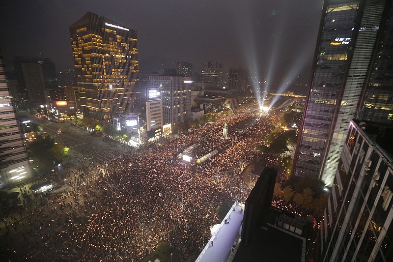 
              In this Saturday, Nov. 5, 2016 photo, South Korean protesters stage a rally calling for South Korean President Park Geun-hye to step down in downtown Seoul, South Korea. South Korea is seeing its biggest wave of street demonstrations in decades but nobody is sure how many people are taking to the streets each week. At first media relied on two sources - the police and the organizer. But they have been accused of underestimating or overestimating the crowds in the previous four Saturdays (AP Photo/Ahn Young-joon, File)
            