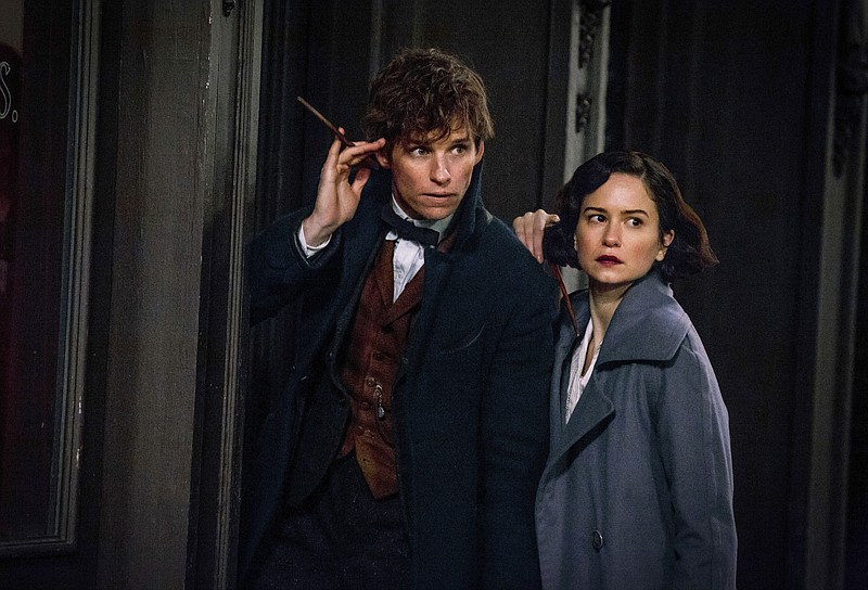 This image released by Warner Bros. Entertainment shows Eddie Redmayne, left, and Katherine Waterston in a scene from, "Fantastic Beasts and Where to Find Them." (Jaap Buitendijk/Warner Bros. via AP)