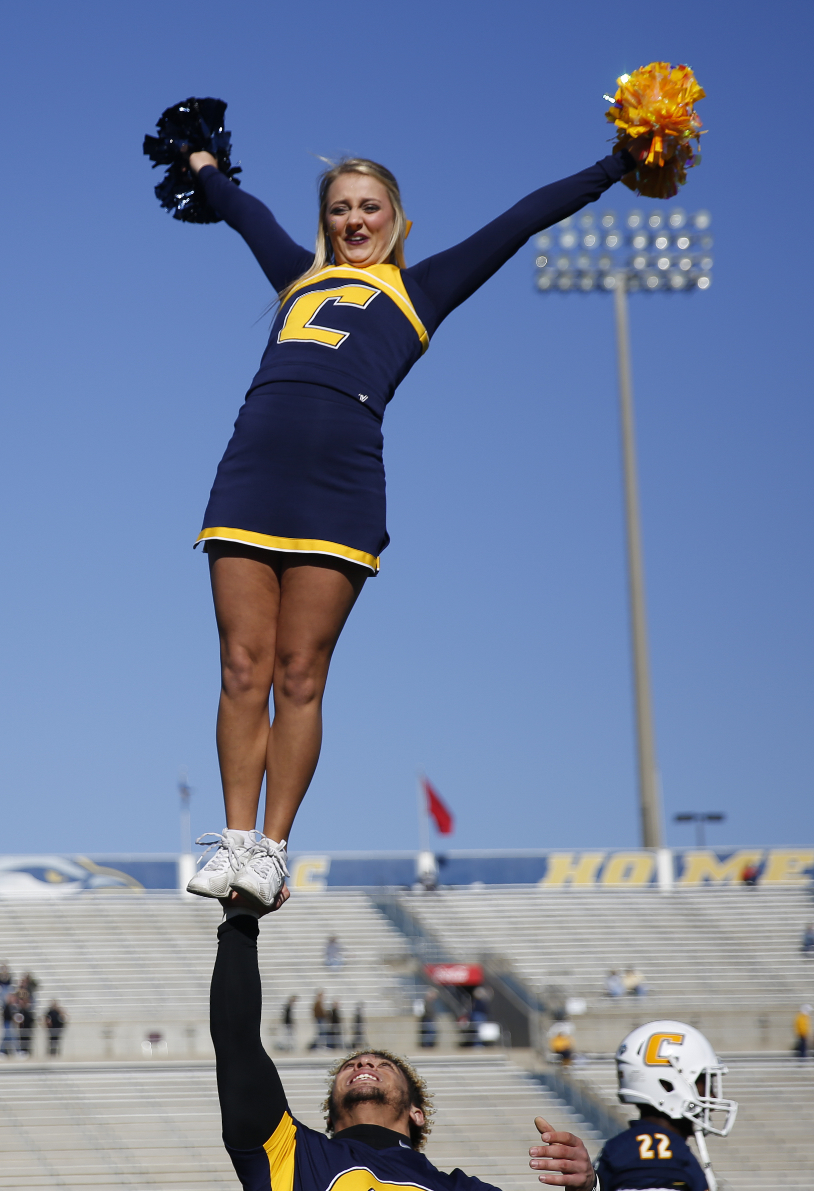 UTC cheerleader Mckenzie Hammond loses her balance on teammate Skylar Hopewell's hand during the Mocs' first-round FCS football playoff game against Weber State at Finely Stadium on Saturday, Nov. 26, 2016, in Chattanooga, Tenn. UTC won 45-14.