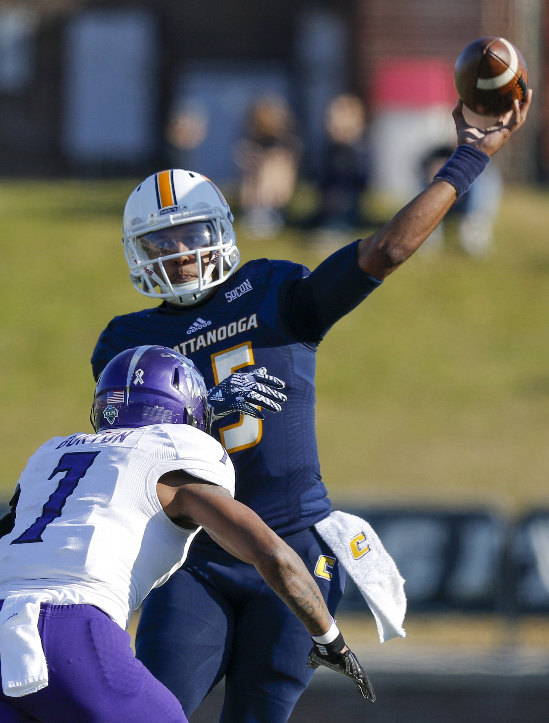 UTC quarterback Alejandro Bennifield passes against pressure by Weber State safety Josh Burton during the Mocs' first-round FCS football playoff game against Weber State at Finely Stadium on Saturday, Nov. 26, 2016, in Chattanooga, Tenn. UTC won 45-14.