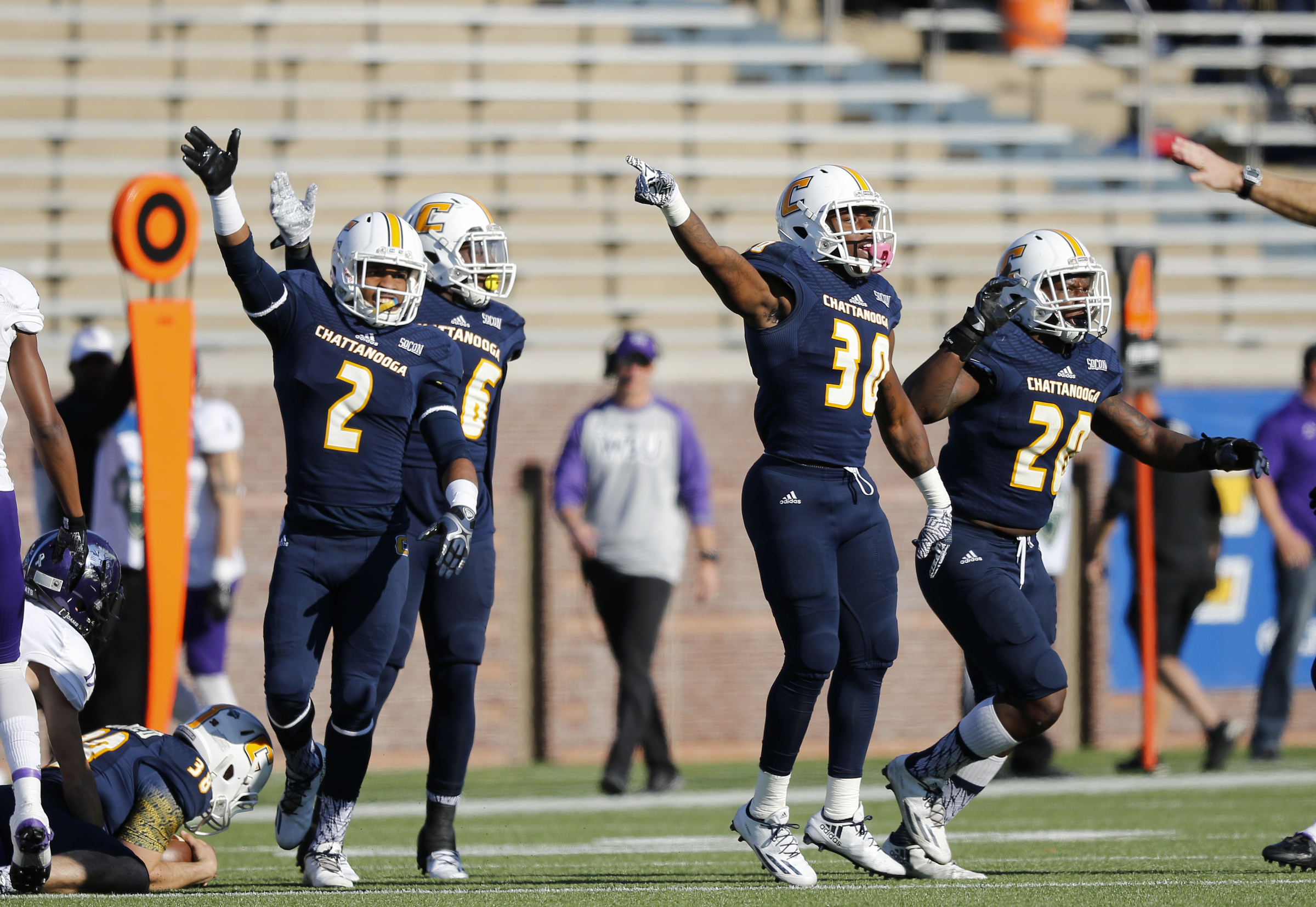UTC defensive players signal a turnover after a fumble recovery during the Mocs' first-round FCS football playoff game against Weber State at Finely Stadium on Saturday, Nov. 26, 2016, in Chattanooga, Tenn. UTC won 45-14.