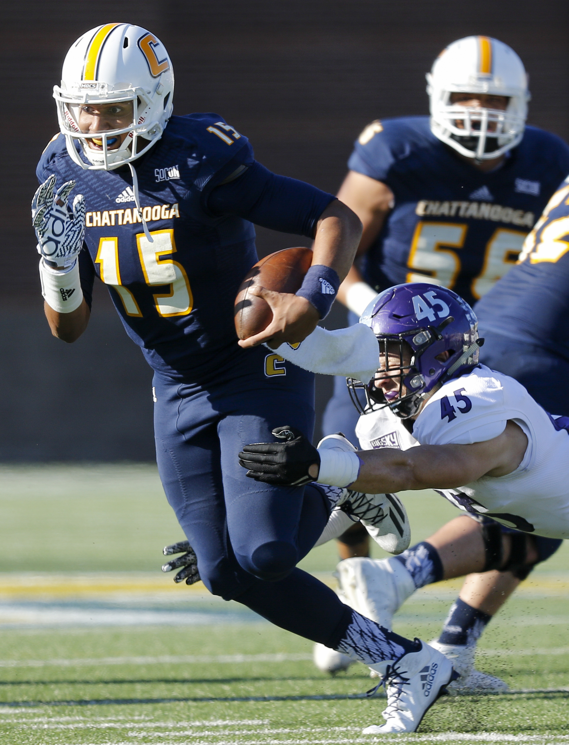 UTC quarterback Alejandro Bennifield breaks a tackle by Weber State linebacker Landon Stice during the Mocs' first-round FCS football playoff game against Weber State at Finely Stadium on Saturday, Nov. 26, 2016, in Chattanooga, Tenn. UTC won 45-14.