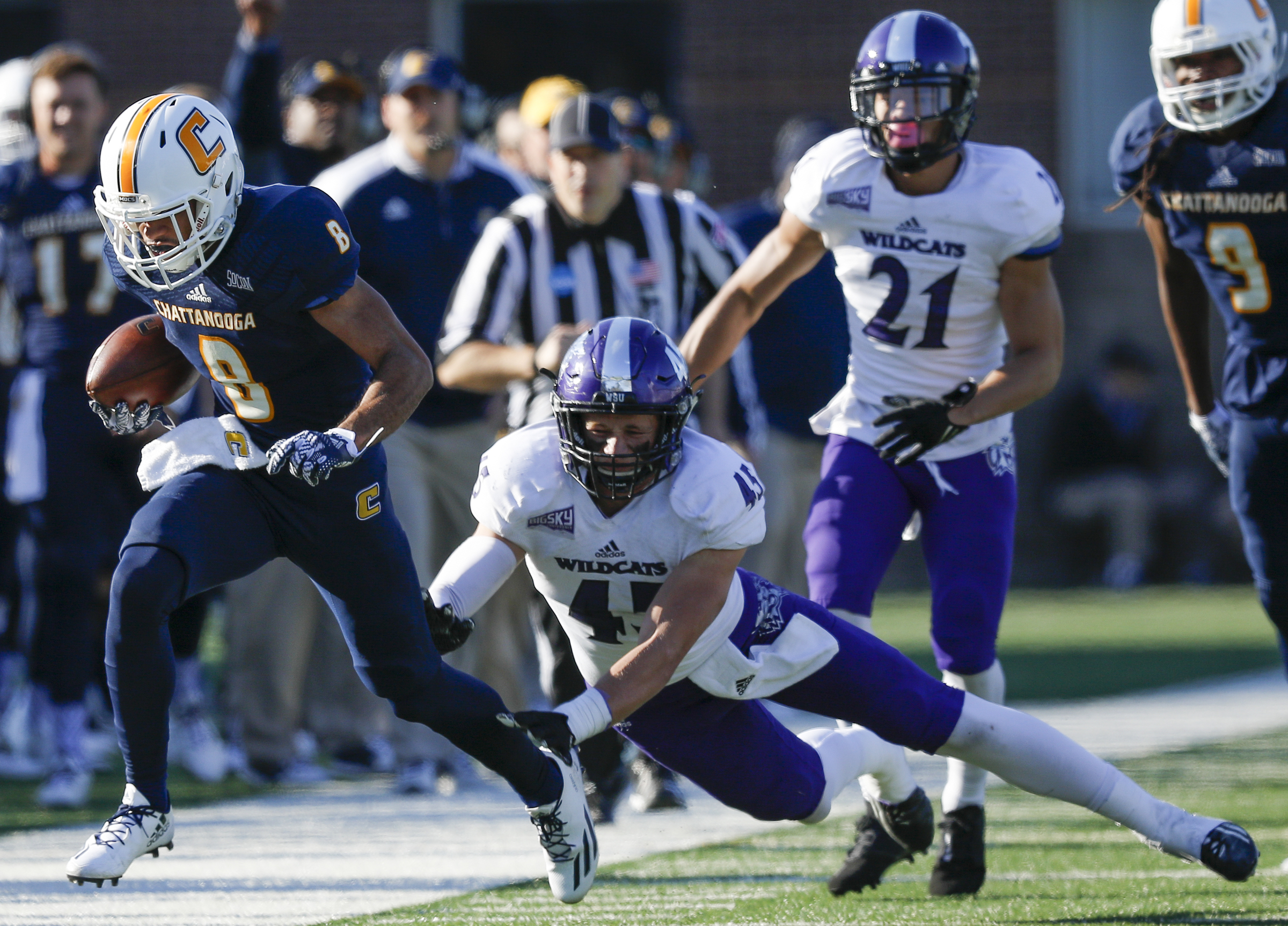 Weber State linebacker Landon Slice forces UTC wide receiver C.J. Board out of bounds during the Mocs' first-round FCS football playoff game against Weber State at Finely Stadium on Saturday, Nov. 26, 2016, in Chattanooga, Tenn. UTC won 45-14.