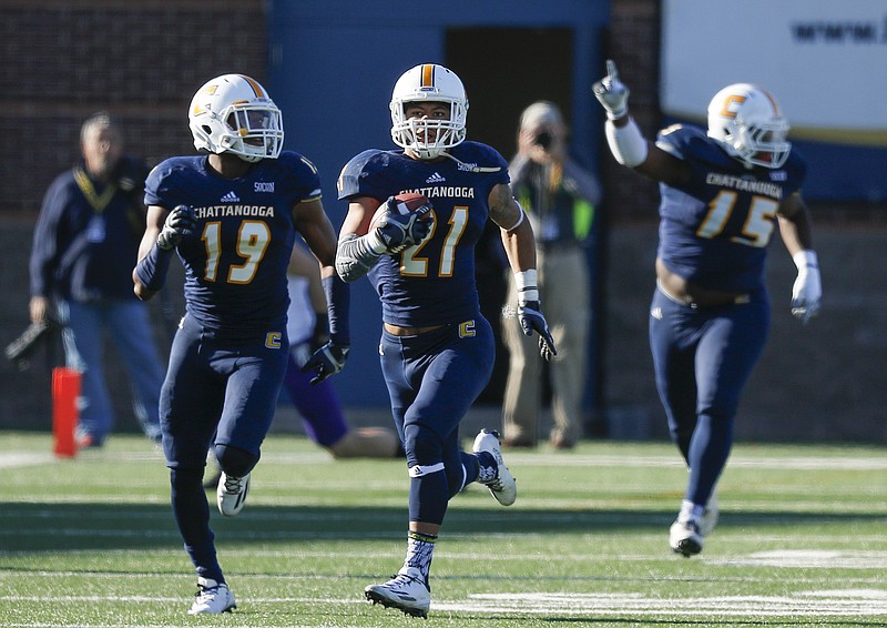 UTC defensive back Montrell Pardue (21) returns a fumbled ball for a 99 yard touchdown during the Mocs' first-round FCS football playoff game against Weber State at Finely Stadium on Saturday, Nov. 26, 2016, in Chattanooga, Tenn. UTC won 45-14.