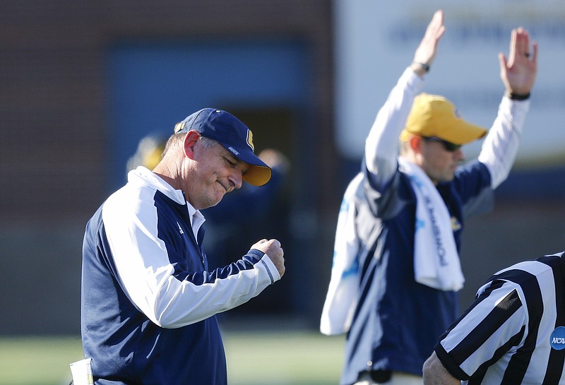 UTC head coach Russ Huesman celebrates as defensive back Montrell Pardue's 99 yard fumble return for a touchdown is confirmed in review during the Mocs' first-round FCS football playoff game against Weber State at Finely Stadium on Saturday, Nov. 26, 2016, in Chattanooga, Tenn. UTC won 45-14.