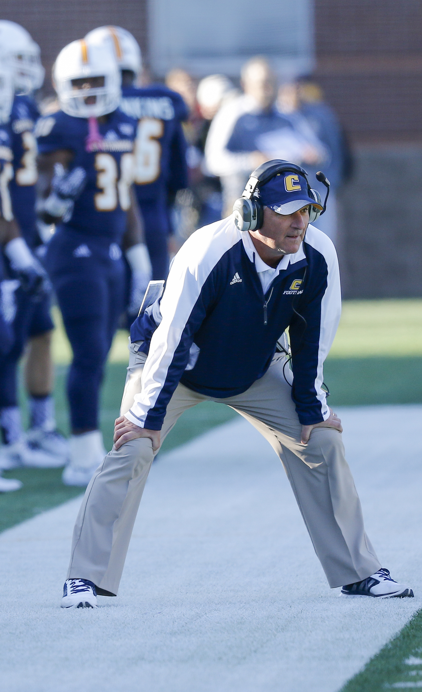 UTC head football coach Russ Huesman watches from the sideline during the Mocs' first-round FCS football playoff game against Weber State at Finely Stadium on Saturday, Nov. 26, 2016, in Chattanooga, Tenn. UTC won 45-14.