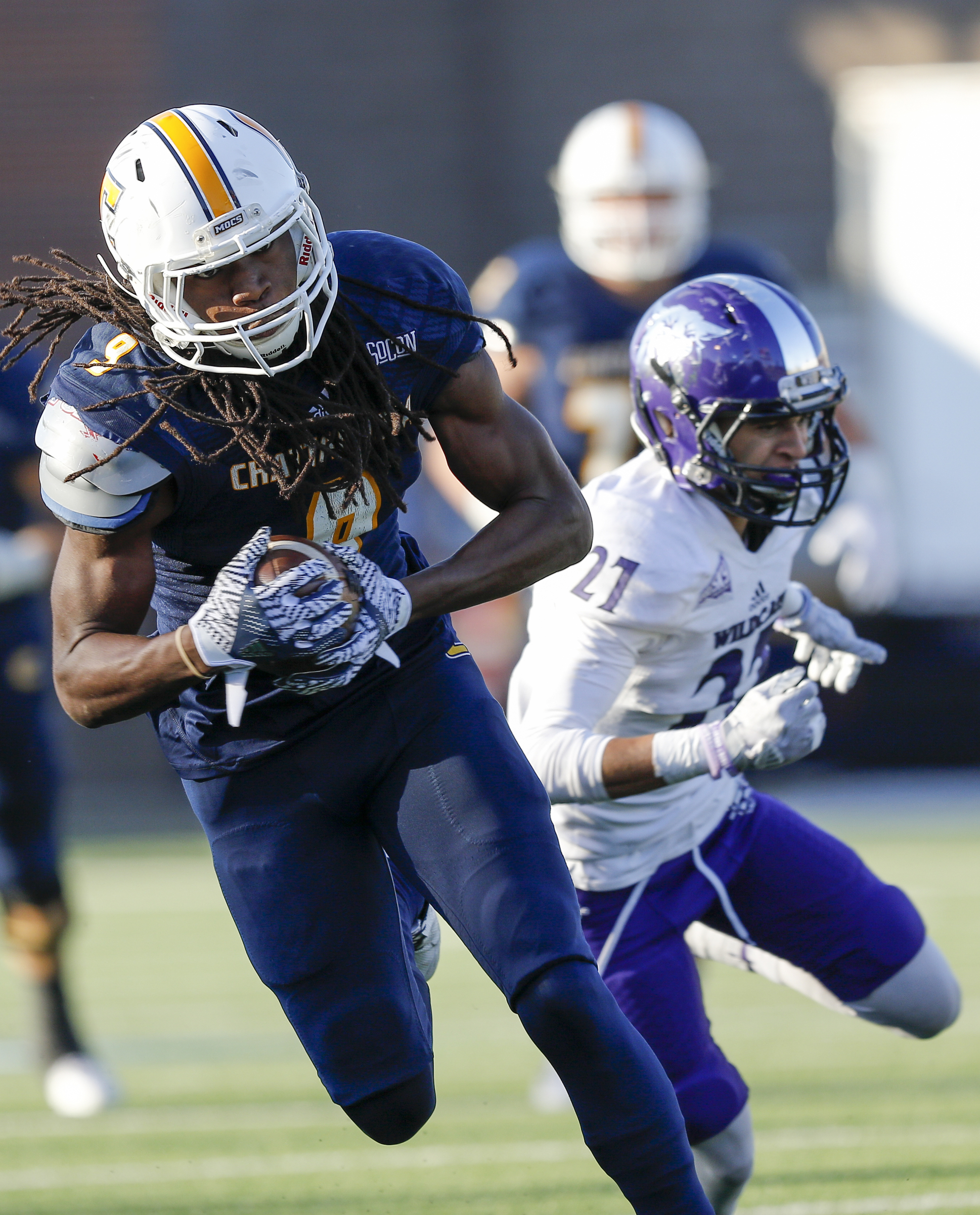 UTC wide receiver Alphonso Stewart breaks ahead of Weber State cornerback Dre Snowden four a touchdown during the Mocs' first-round FCS football playoff game against Weber State at Finely Stadium on Saturday, Nov. 26, 2016, in Chattanooga, Tenn. UTC won 45-14.
