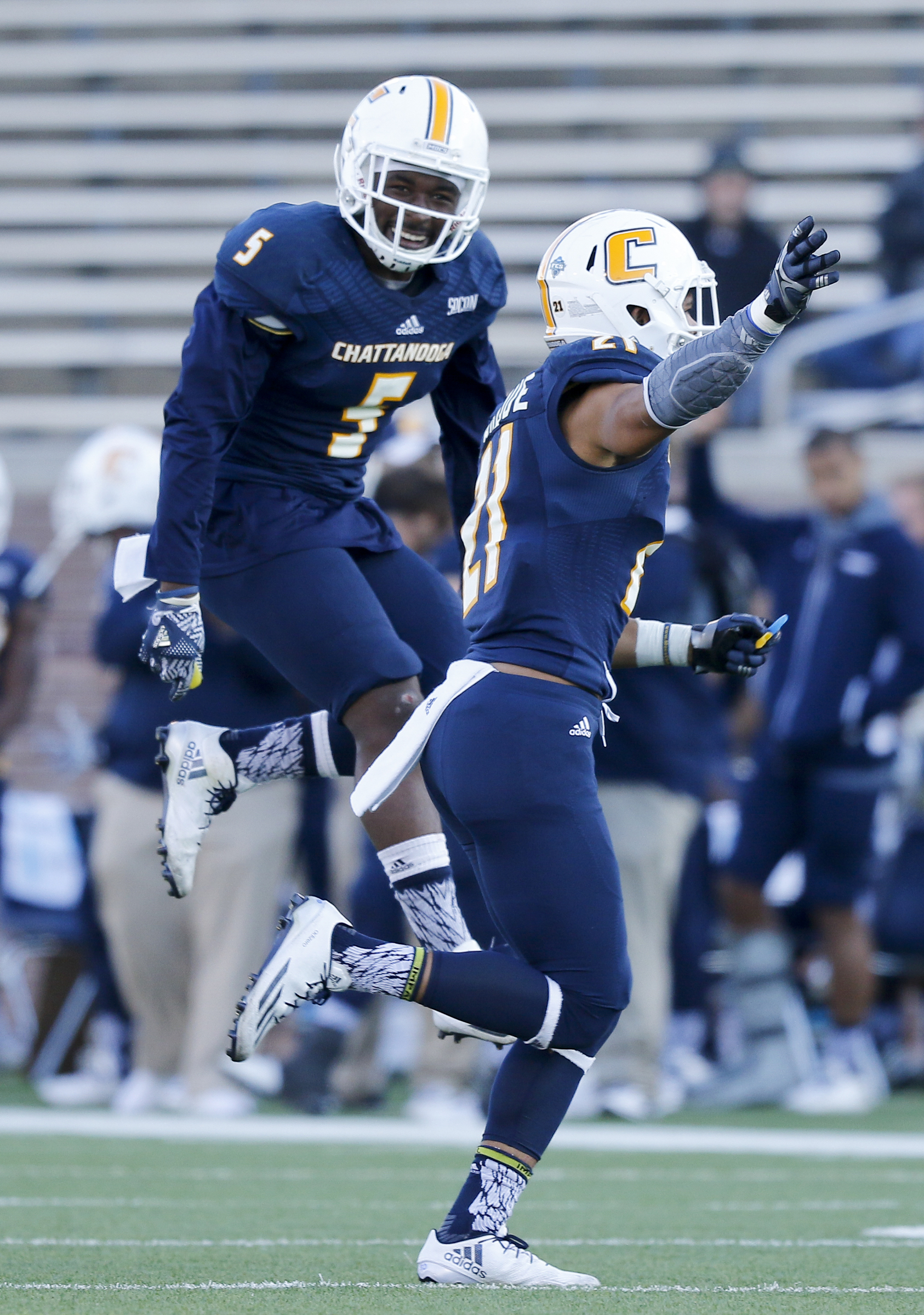 UTC linebacker Nakevion Leslie, left, and defensive back Montrell Pardue celebrate a turnover during the Mocs' first-round FCS football playoff game against Weber State at Finely Stadium on Saturday, Nov. 26, 2016, in Chattanooga, Tenn. UTC won 45-14.