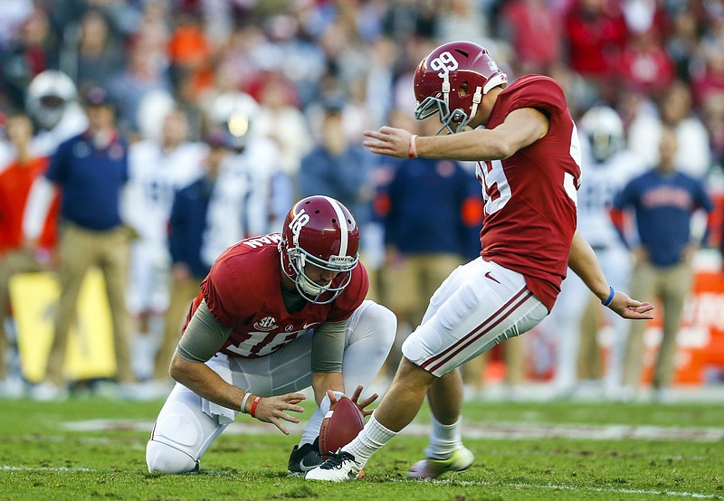 Alabama place kicker Adam Griffith (99) kicks a field goal during the first half of the Iron Bowl NCAA college football game against Auburn, Saturday, Nov. 26, 2016, in Tuscaloosa, Ala. (AP Photo/Butch Dill)