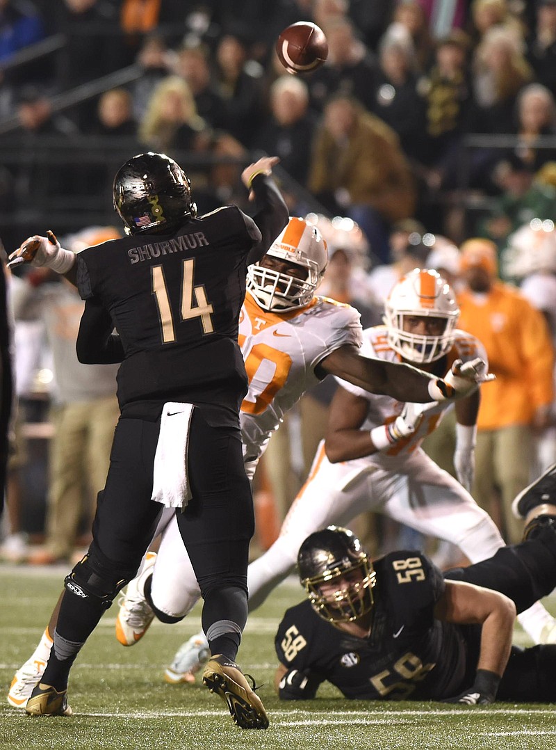 Vanderbilt's Kyle Shurmur (14) passes over Tennessee's Corey Vereen (50).  The Tennessee Volunteers visited the Vanderbilt Commodores in a cross-state rivalry at Dudley Stadium on November 26, 2016.  