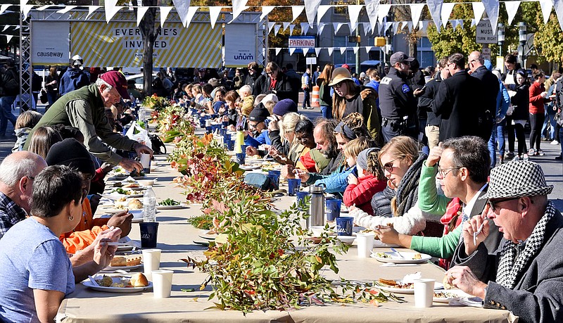 Causeway holds its third annual One Table Community Thanksgiving Potluck lunch in the middle of M.L. King Jr. Boulevard. Causeway Executive Director Abby Garrison was hoping for a record crowd for the free, collaborative meal.