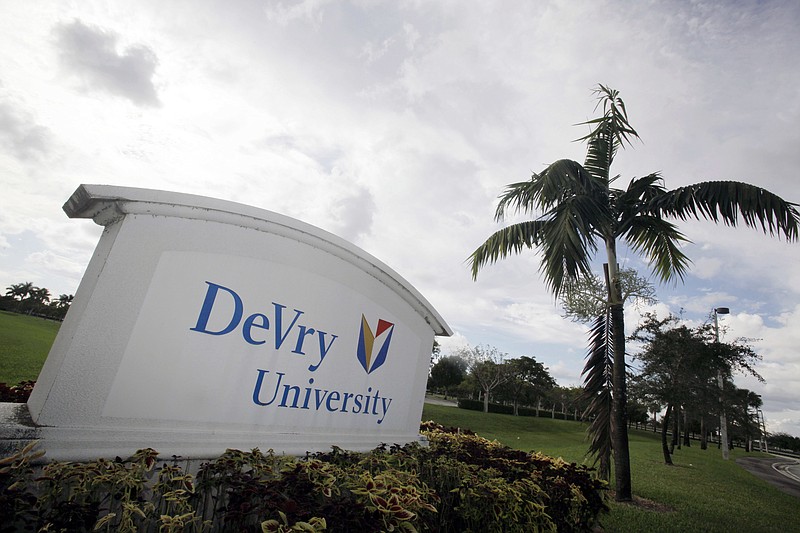 FILE - This Nov. 24, 2009, file photo, shows the entrance to the DeVry University in Miramar, Fla. Since Donald Trump's election on Nov. 8, 2016, shares in the parent company of DeVry University have increased to their highest value in more than a year. The DeVry Education Group said in a statement that it will work with the incoming Trump administration and "offer suggestions and reforms for higher education." (AP Photo/J Pat Carter, File)