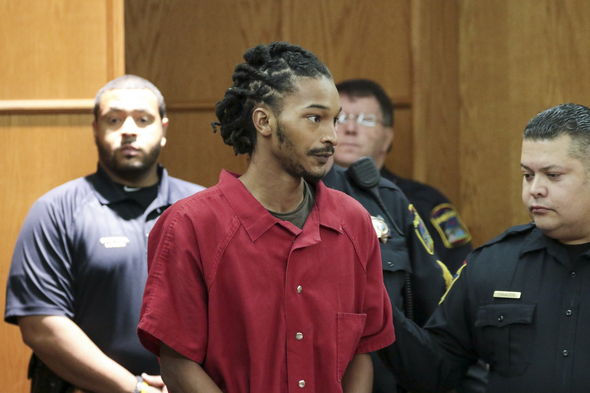 Staff Photo by Dan Henry / The Chattanooga Times Free Press- 11/29/16. Johnthony Walker, the bus driver charged in the school bus crash on Talley Road that left six children dead and others injured on November 21, makes his first appearance in Judge Lila Statom's courtroom on Tuesday, November 29, 2016.