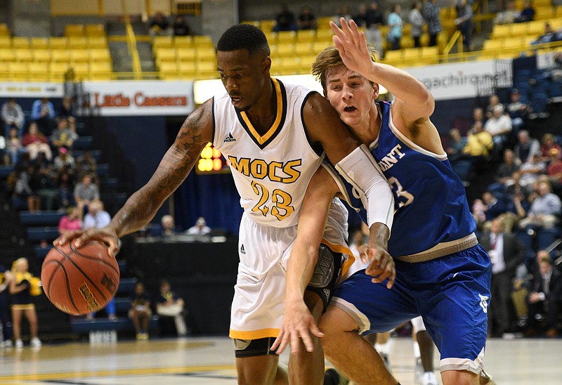 UTC's Tre' McLean is guarded by Covenant's Bailey Spragg Friday, Nov. 4, 2016 at McKenzie Arena.