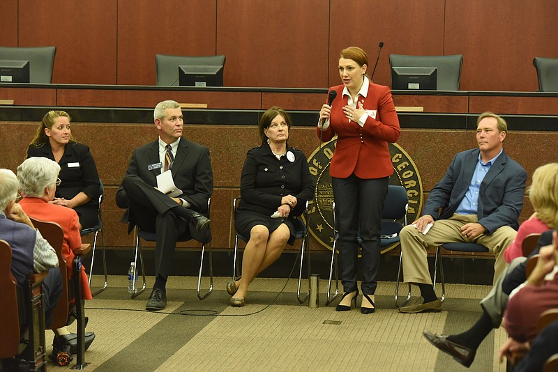 Georgia state senate candidate Shell Underwood stands and makes opening statements at a forum Tuesday night inside the city council chambers at Dalton City Hall. From left are, Conda Goodson, Chuck Payne, Debby Peppers, Underwood and William (Billy) Vinyard. 