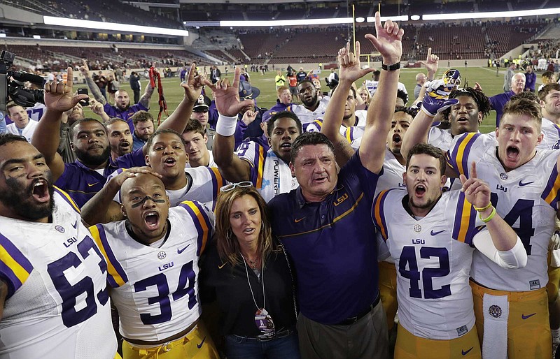 LSU coach Ed Orgeron celebrates with his players following last Thursday's 54-39 win at Texas A&M.