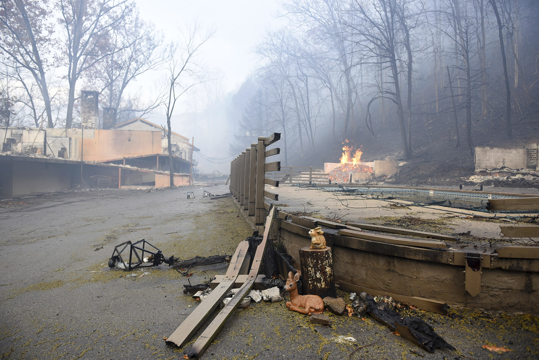 Smoke from wildfires fill the air around Gatlinburg, Tenn., on Tuesday, Nov. 29, 2016. Rain had begun to fall in some areas, but experts predicted it would not be enough to end the relentless drought that has spread across several Southern states and provided fuel for fires now burning for weeks in states including Tennessee, Georgia and North Carolina. (Michael Patrick/Knoxville News Sentinel via AP)