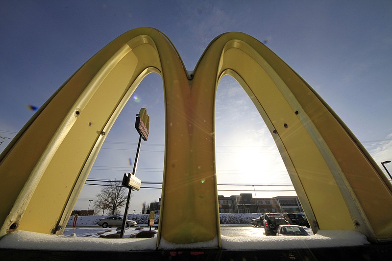 
              FILE - This Jan. 21, 2014 file photo, cars drive past the McDonald's Golden Arches logo at a McDonald's restaurant in Robinson Township, Pa. McDonald said Monday, Nov. 28, 2016, that is testing the use of fresh, never-frozen beef for its Quarter Pounder hamburgers. (AP Photo/Gene J. Puskar, File)
            