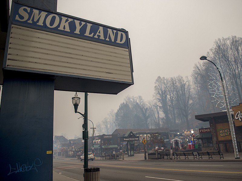 Thick smoke from area forest fires looms in Gatlinburg, Tenn., Monday, Nov. 28, 2016. Gatlinburg officials say several areas are being evacuated as a result of fires in and around Great Smoky Mountains National Park. (Brianna Paciorka/Knoxville News Sentinel via AP)