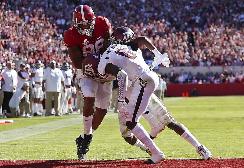 Alabama senior tight end O.J. Howard, shown catching a touchdown pass in the Crimson Tide's 33-14 win over Texas A&M on Oct. 22, is among the 10 potential 2017 NFL first-round draft picks expected to play in Saturday's Southeastern Conference title game.