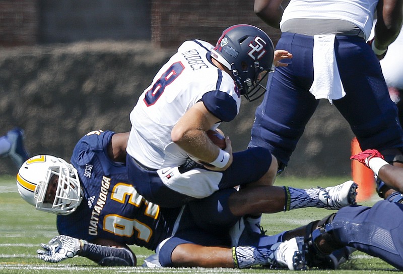 UTC defensive lineman Keionta Davis sacks Samford quarterback Devlin Hodges during the Mocs' home football game against the Bulldogs at Finley Stadium on Saturday, Sept. 24, 2016, in Chattanooga, Tenn.