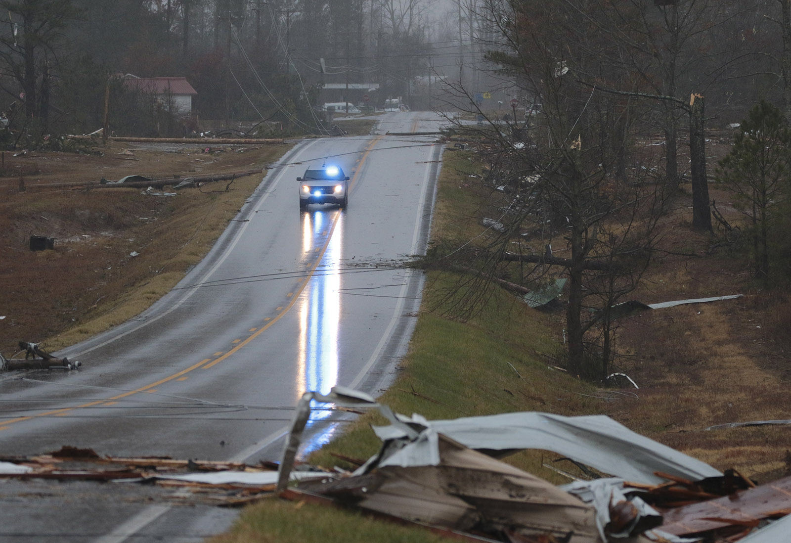 Staff Photo by Dan Henry / The Chattanooga Times Free Press- 11/30/16. Emergency and utility personnel work a one-plus mile stretch of Rosalie, AL, on Wednesday, Nov 30, 2016 where a suspected tornado touched down overnight killing three from the community