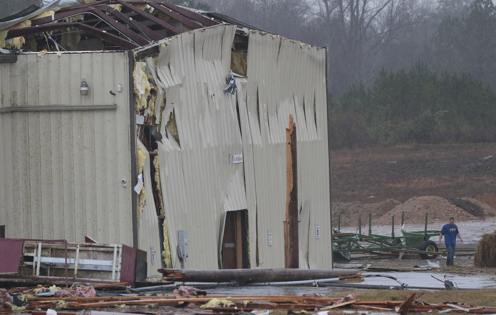 Staff Photo by Dan Henry / The Chattanooga Times Free Press- 11/30/16. Community members and volunteers survey damage done to the Macklin Baptist Church after a suspected tornado touched down in Rosalie, AL, on Wednesday, Nov 30, 2016 killing three from the community.