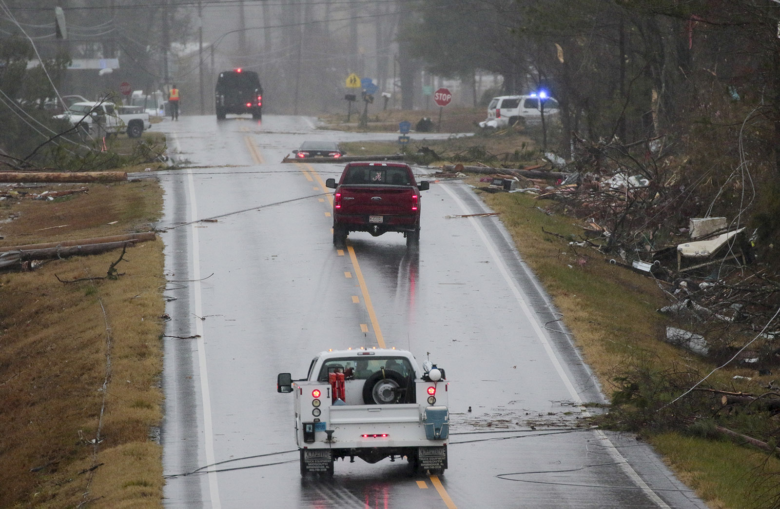 Staff Photo by Dan Henry / The Chattanooga Times Free Press- 11/30/16. Emergency and utility personnel work a one-plus mile stretch of Rosalie, AL, on Wednesday, Nov 30, 2016 where a suspected tornado touched down overnight killing three from the community