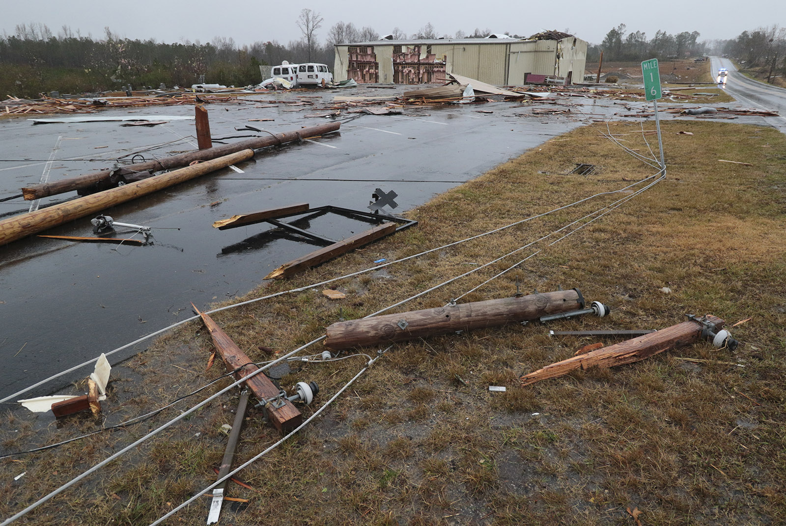 Staff Photo by Dan Henry / The Chattanooga Times Free Press- 11/30/16. Community members and volunteers survey damage done to the Macklin Baptist Church after a suspected tornado touched down in Rosalie, AL, on Wednesday, Nov 30, 2016 killing three from the community.