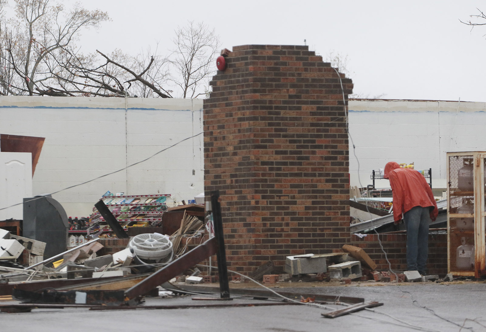 Staff Photo by Dan Henry / The Chattanooga Times Free Press- 11/30/16. Tyler Jeffery surveys the damage done to the Rosalie Plaza Grocery in Rosalie, AL, on Wednesday, Nov 30, 2016 where a suspected tornado touched down overnight killing three from the community.
