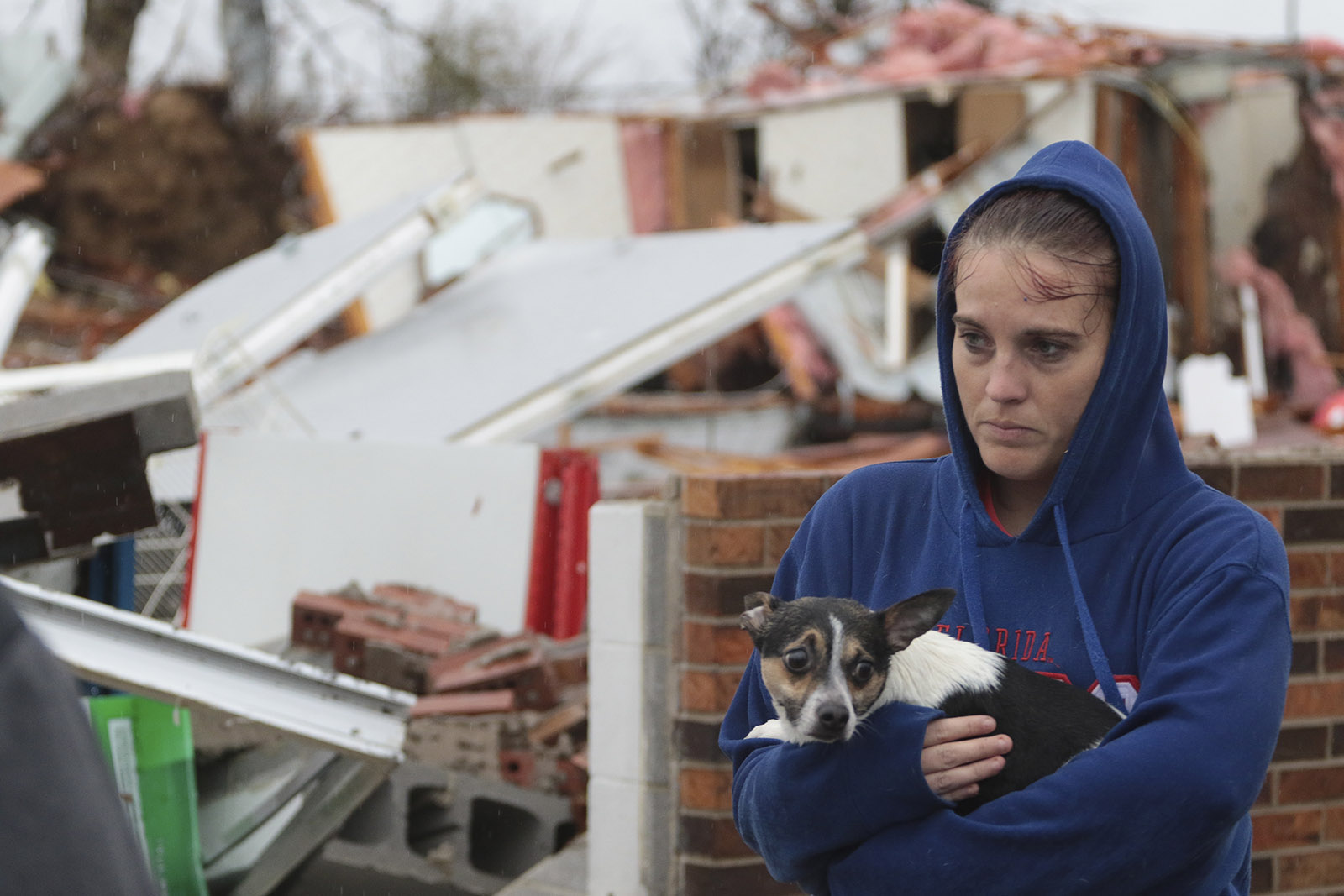 Staff Photo by Dan Henry / The Chattanooga Times Free Press- 11/30/16. Shaylyn Jeffery holds the building owner's dog