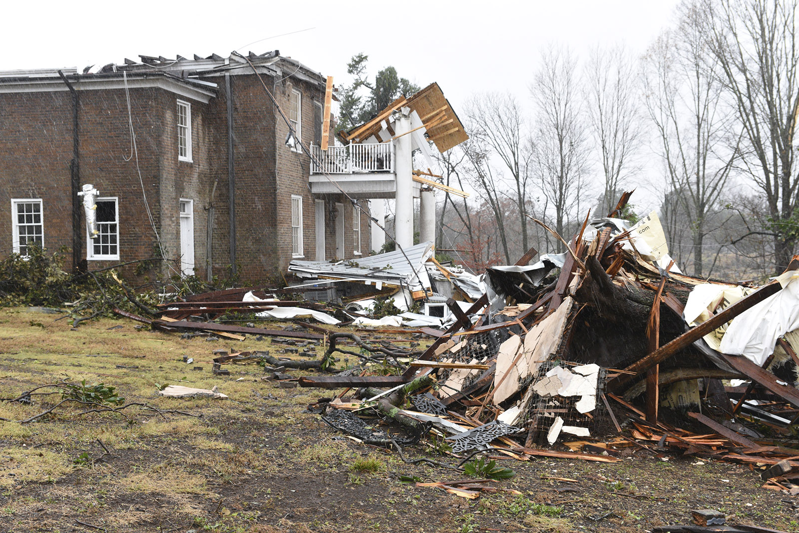 Debris litters Lisa and Jim Long's yard in Athens, Tenn. Wednesday, Nov. 30, 2016 after a tornado swept through early Wednesday morning. The couple was refurbishing the historic home, while living in the adjacent house.