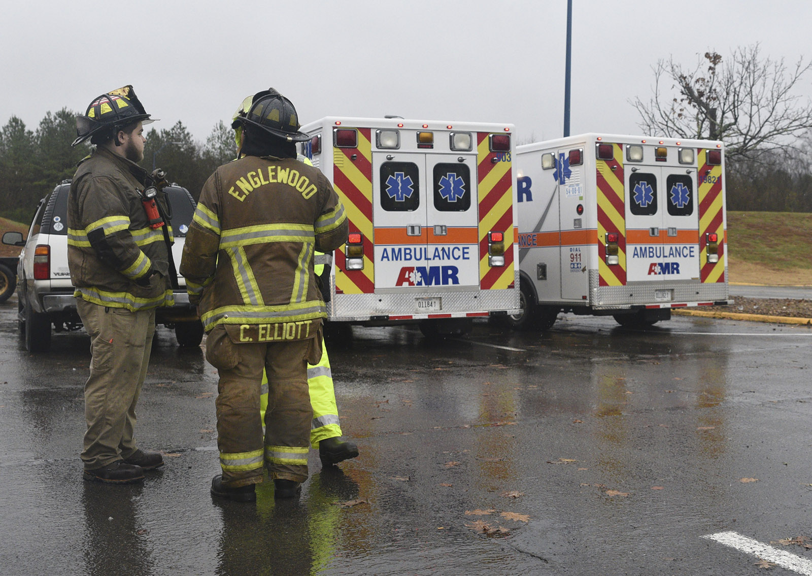 People gather around the command post near Highway 307 in Athens, Tenn., Wednesday, Nov. 30, 2016 while working the area where a tornado touched down early Wednesday.