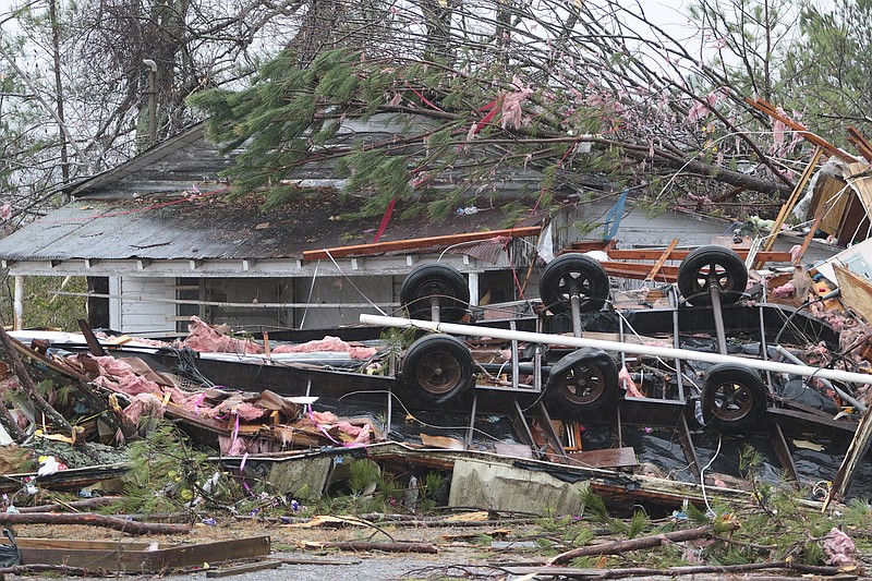 A trailer where three died was tossed into the neighbors yard after a tornado hit the Rosalie, Ala., community on Wednesday, Nov 30, 2016.
