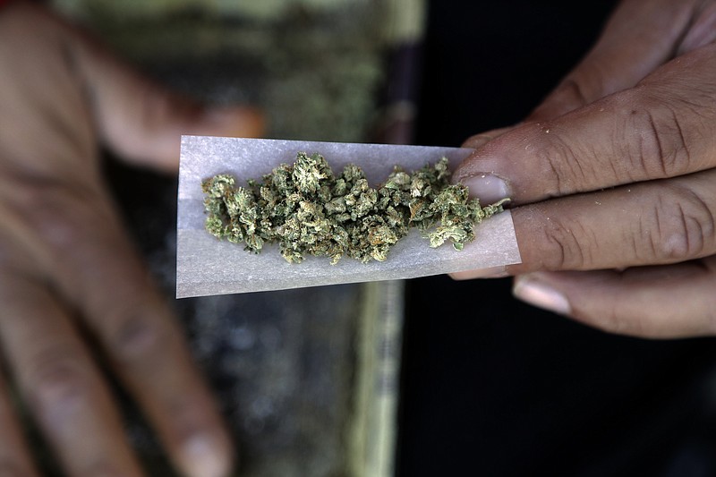 
              FILE - In this Wednesday, Nov. 9, 2016 file photo, a marijuana joint is rolled in San Francisco. Newly-approved laws in four states allowing the recreational use of marijuana are seen as unlikely to change rules regarding use of the drug in the workplace. (AP Photo/Marcio Jose Sanchez, File)
            