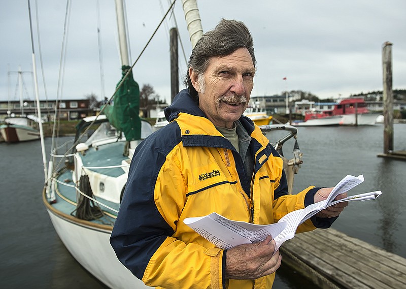 Desmond Doss, Jr. holds correspondence about his father, the subject of the film "Hacksaw Ridge," while on a dock in Ilwaco, Wash. Doss Jr. has been flooded with emails and letters regarding his father, a World War II conscientious objector who won the Congressional Medal of Honor by single-handedly rescuing 75 wounded soldiers.