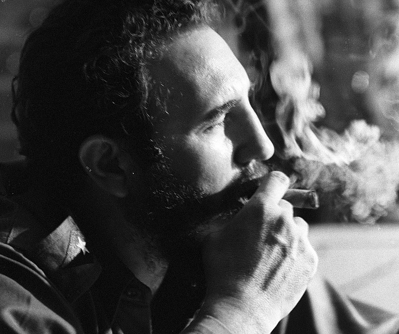 Fidel Castro in 1964 with his trademark cigar during an interview in one of his Havana apartments.