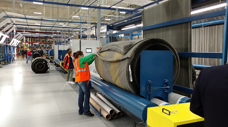 Carpet tile production by Shaw Industries Group employees is underway at the company's new plant in Adairsville, Ga.