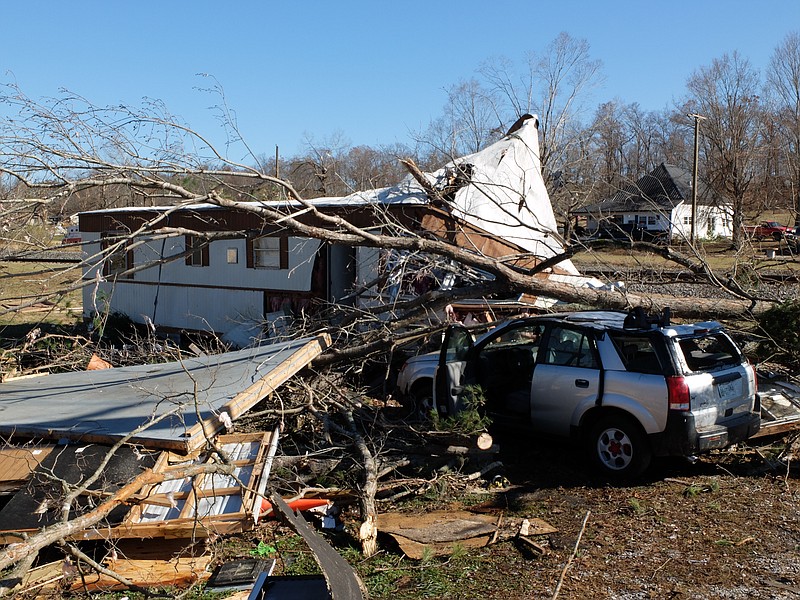 Ben Young and his wife, Jennifer, along with their two children, survived Wednesday's tornado after a tree fell on it and prevented it from being blown away at 2:30 a.m. in Ocoee, Tenn.
