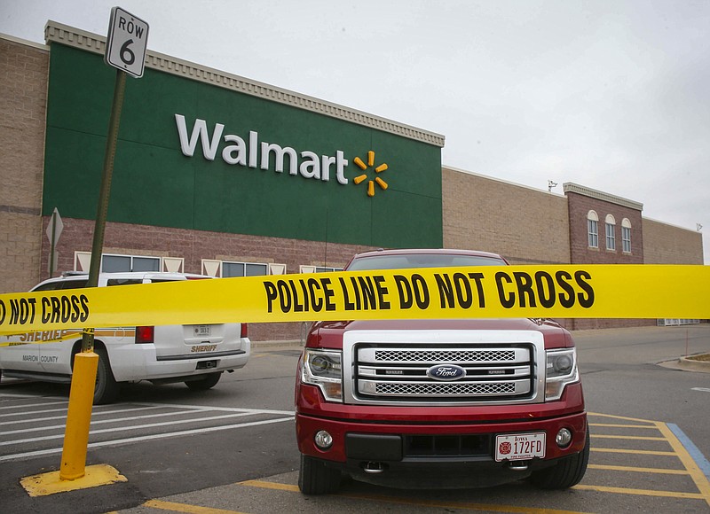 
              Police tape cordons off a portion of a Wal-Mart store after a pickup truck crashed through the front entrance of the grocery portion of the store, killing multiple people, Thursday, Dec. 1, 2016, in Pella, Iowa. (Bryon Houlgrave/The Des Moines Register via AP  )
            